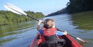 Picture of a child kayaking in a river